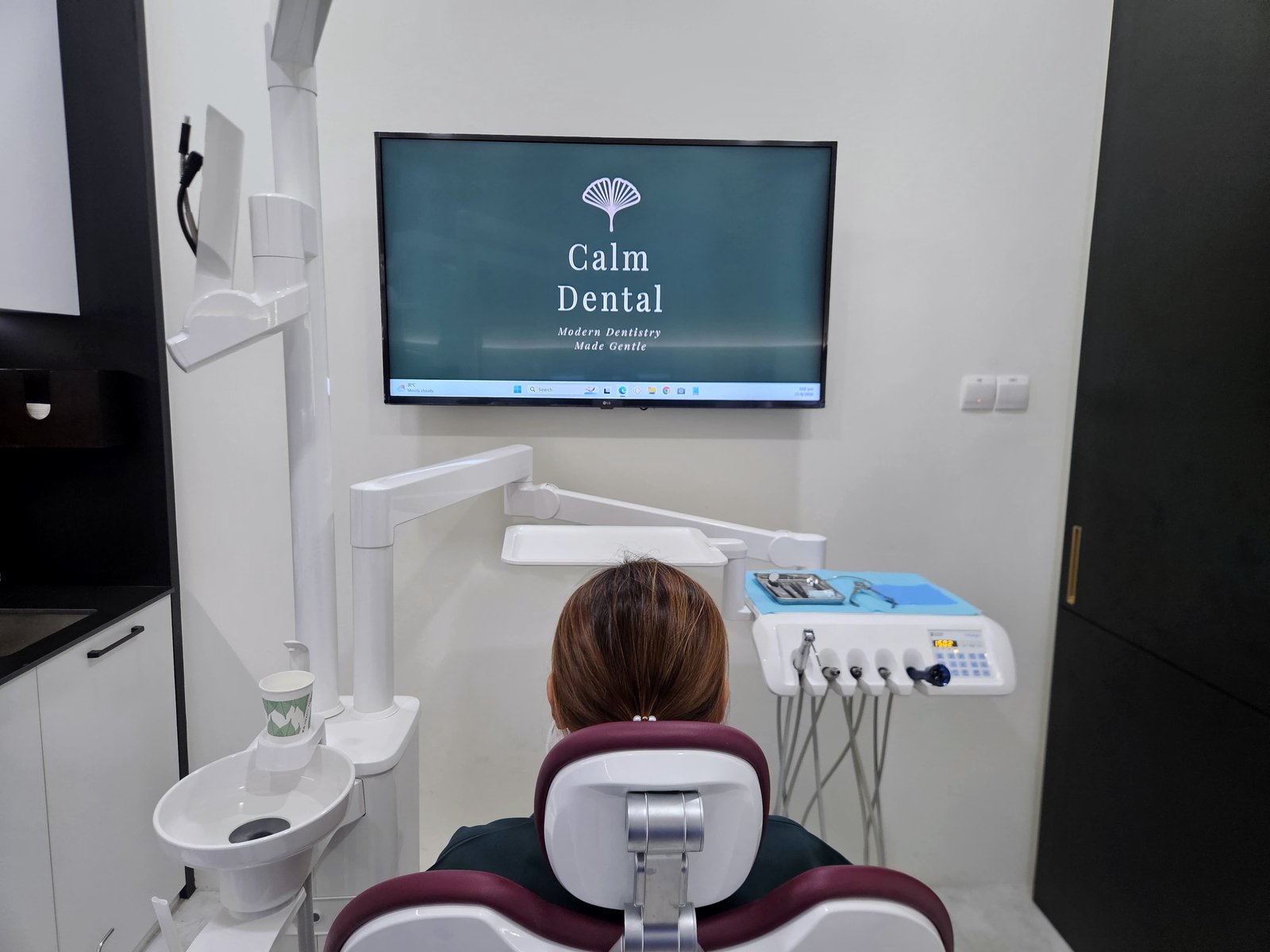 A treatment room at Calm Dental, Millenia Walk, with the screen a patient sees from the chair